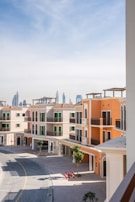 Colorful townhouses stand against a hazy skyline.
