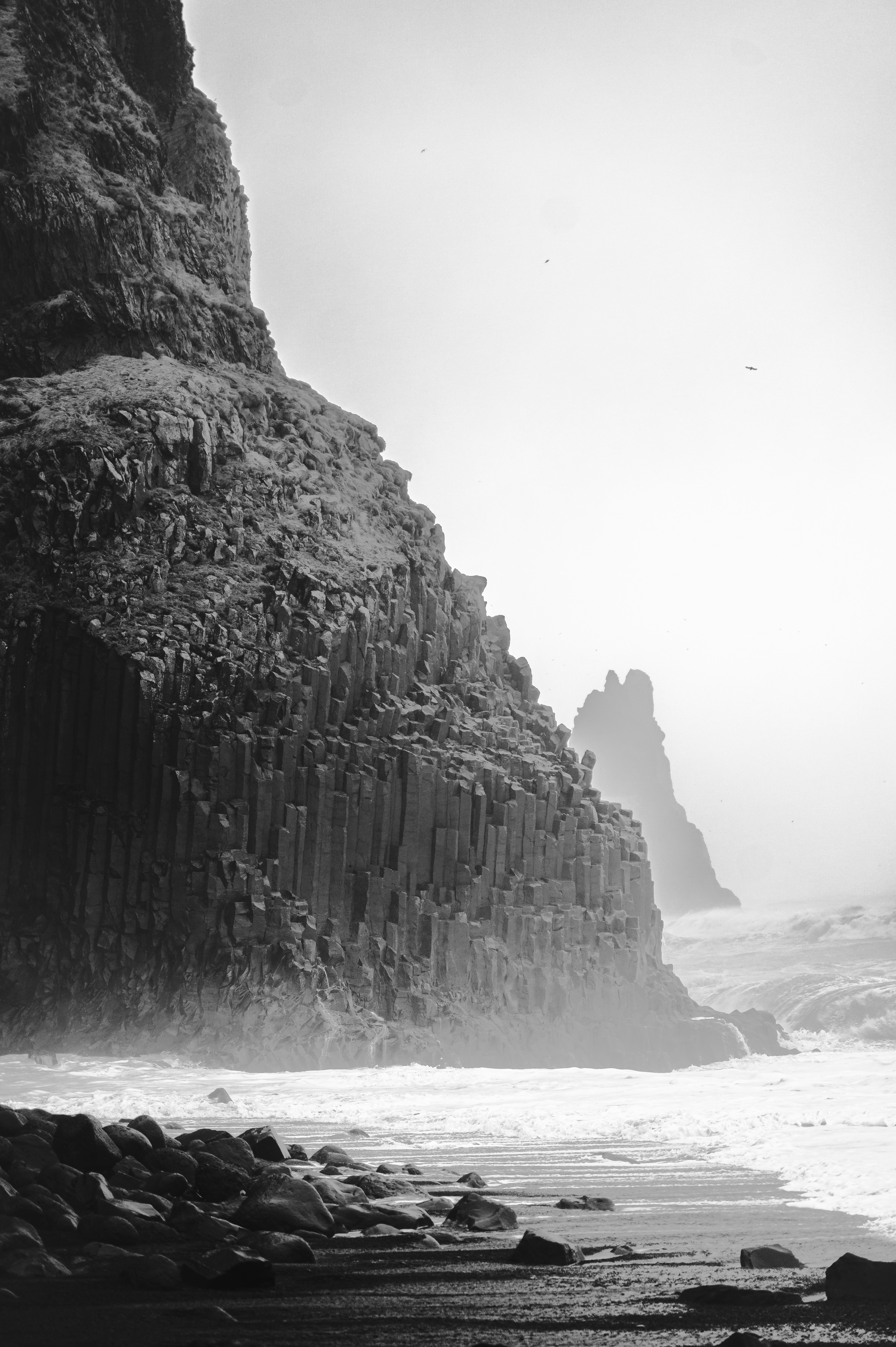 Dramatic coastal cliffs with hexagonal columns.