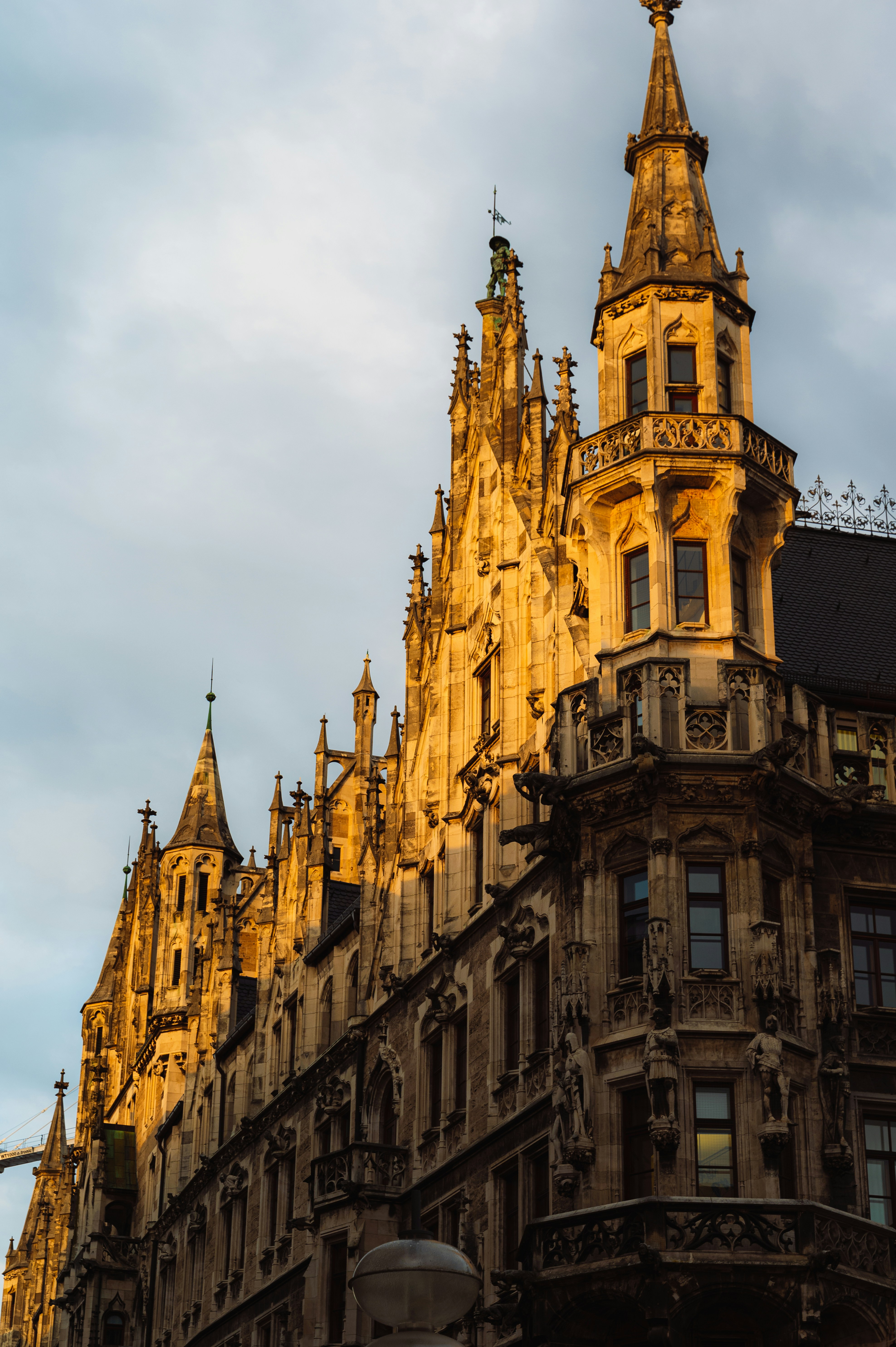 An ornate building is bathed in golden sunlight.