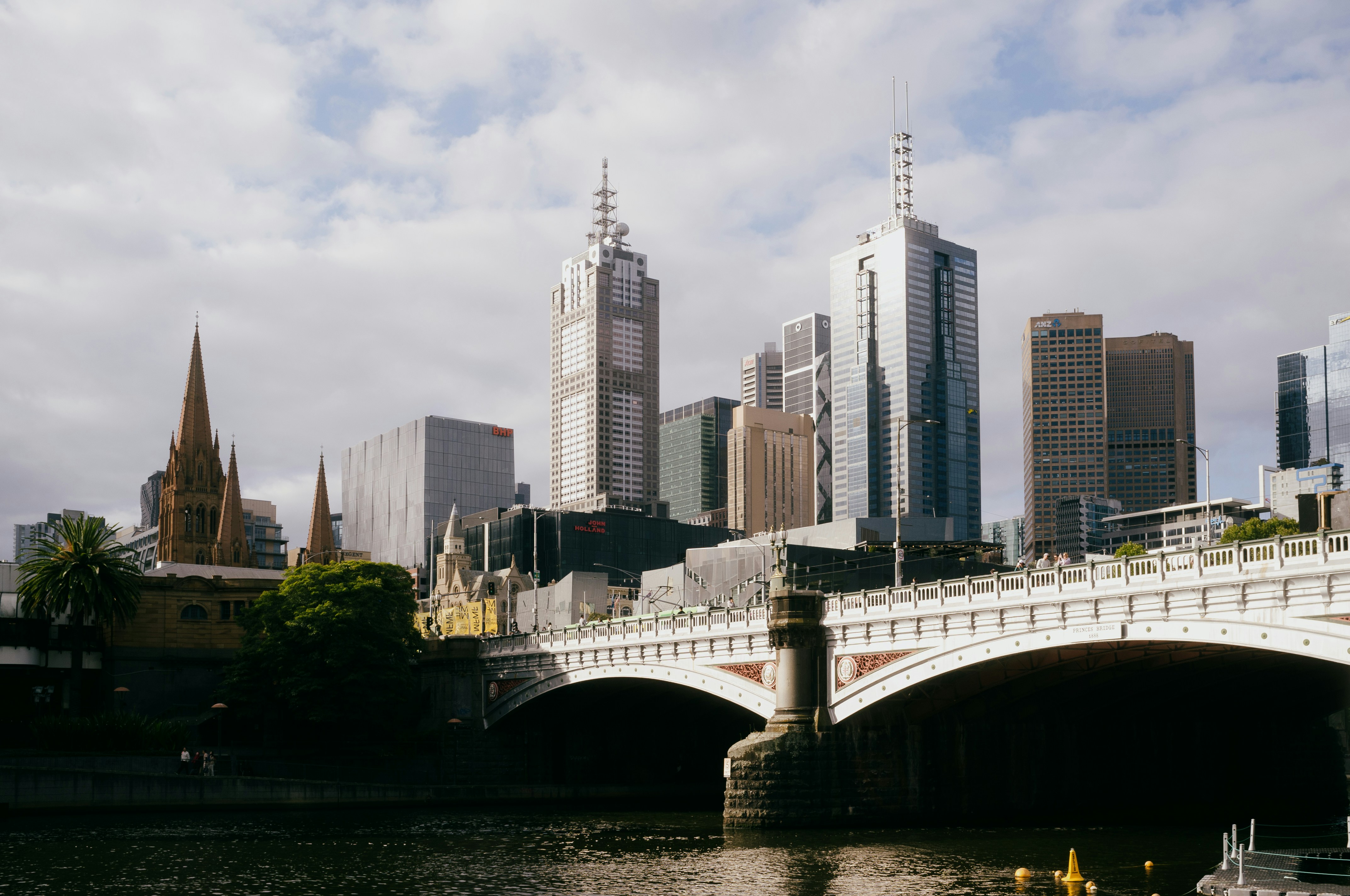 A bridge and melbourne skyline are seen.