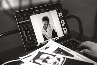 Someone edits a photo on a laptop.