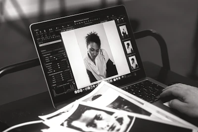 Someone edits a photo on a laptop.