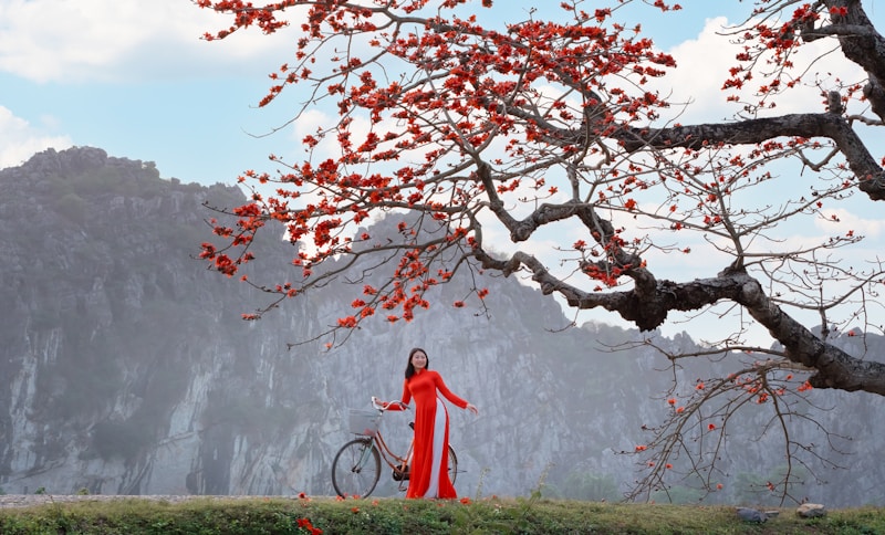 Stylish lady posing by blooming tree