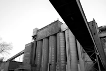 Old industrial building silhouetted against the sky.