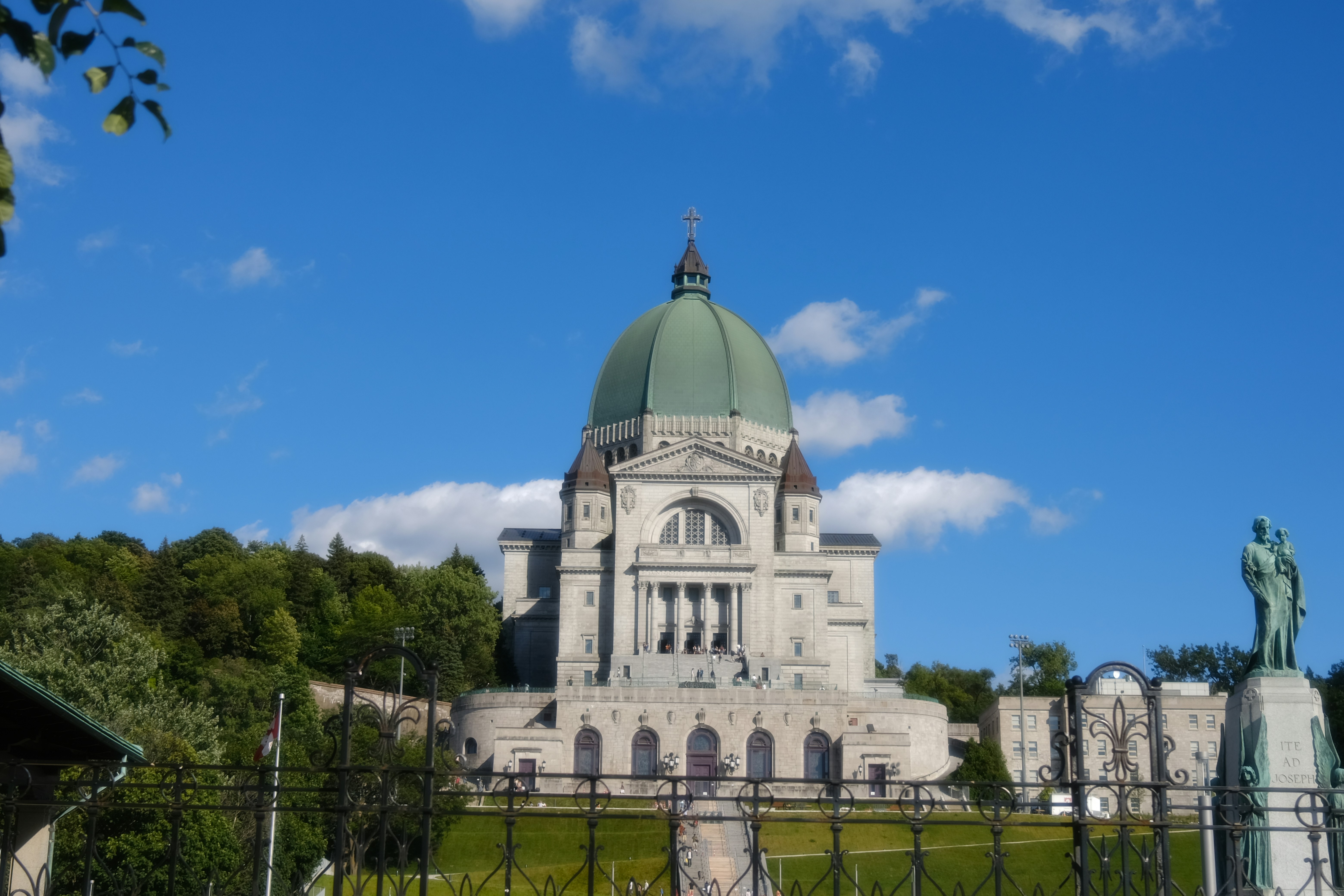 A beautiful building with a green dome.