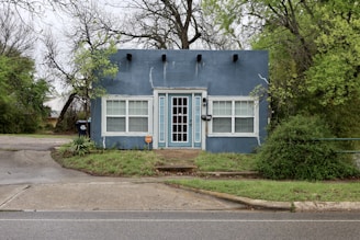 A blue building with white trim.