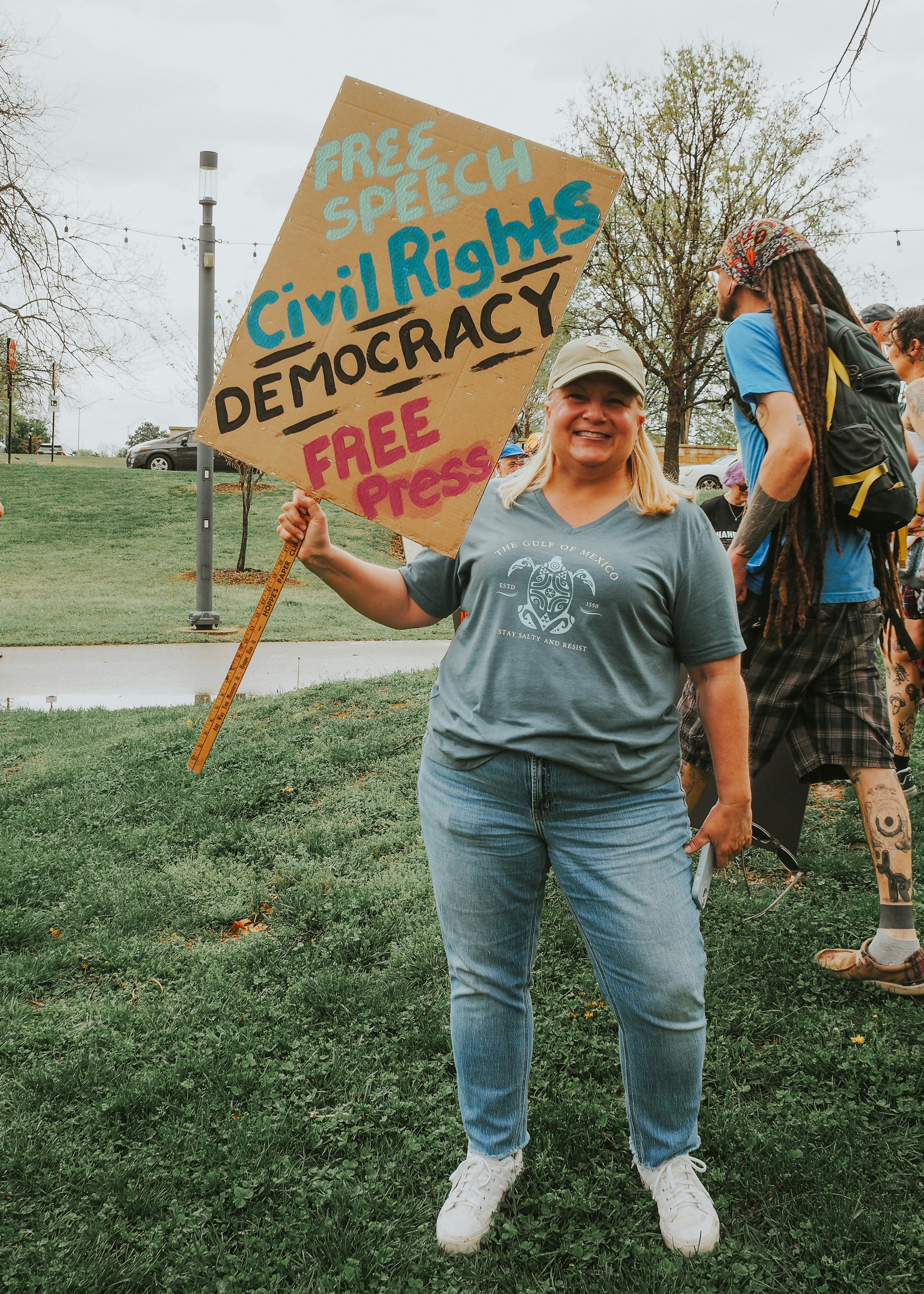 Woman protests for civil rights holding a sign. photo – Free Purple ...