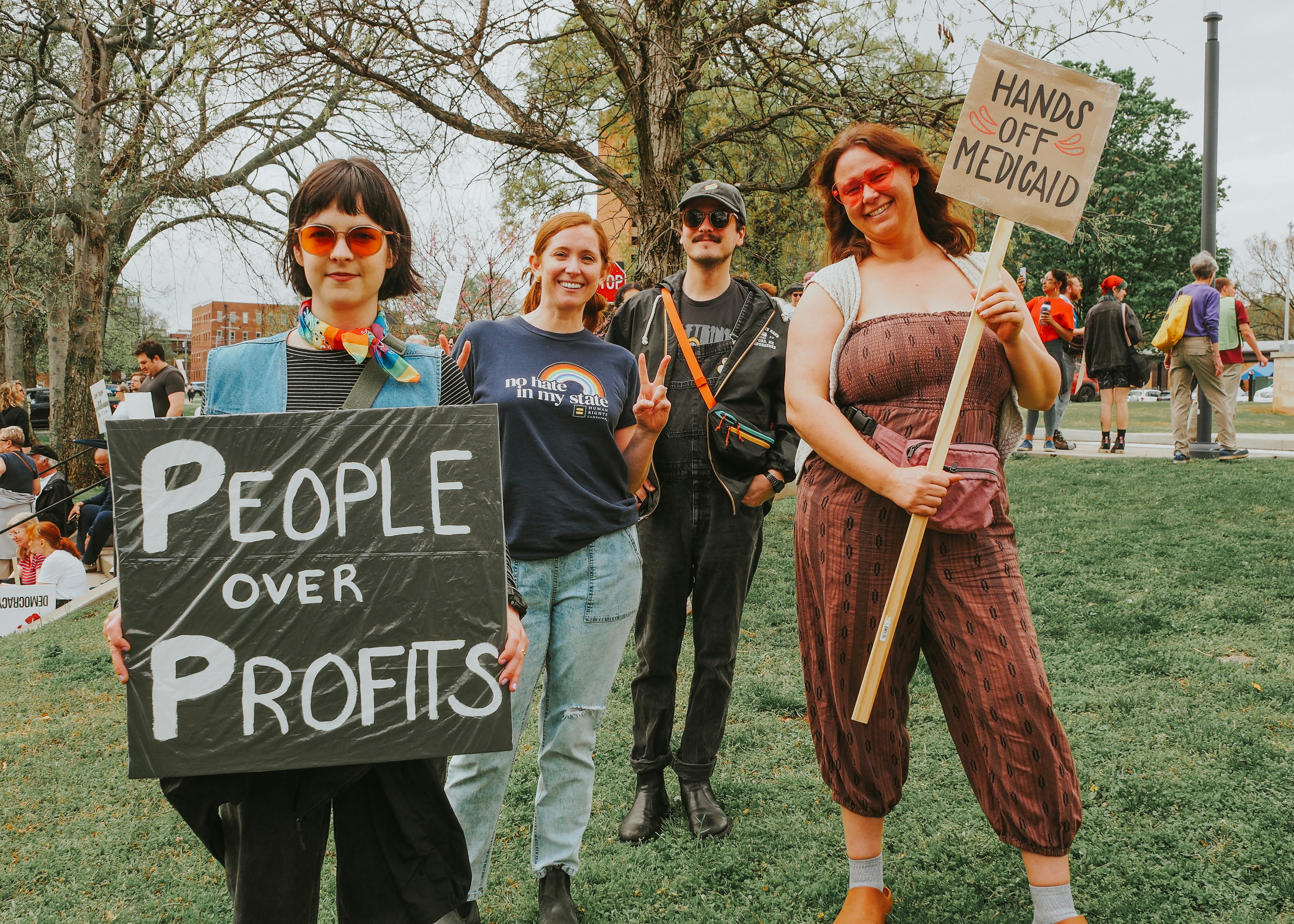 Protestors rally with signs advocating for social change.