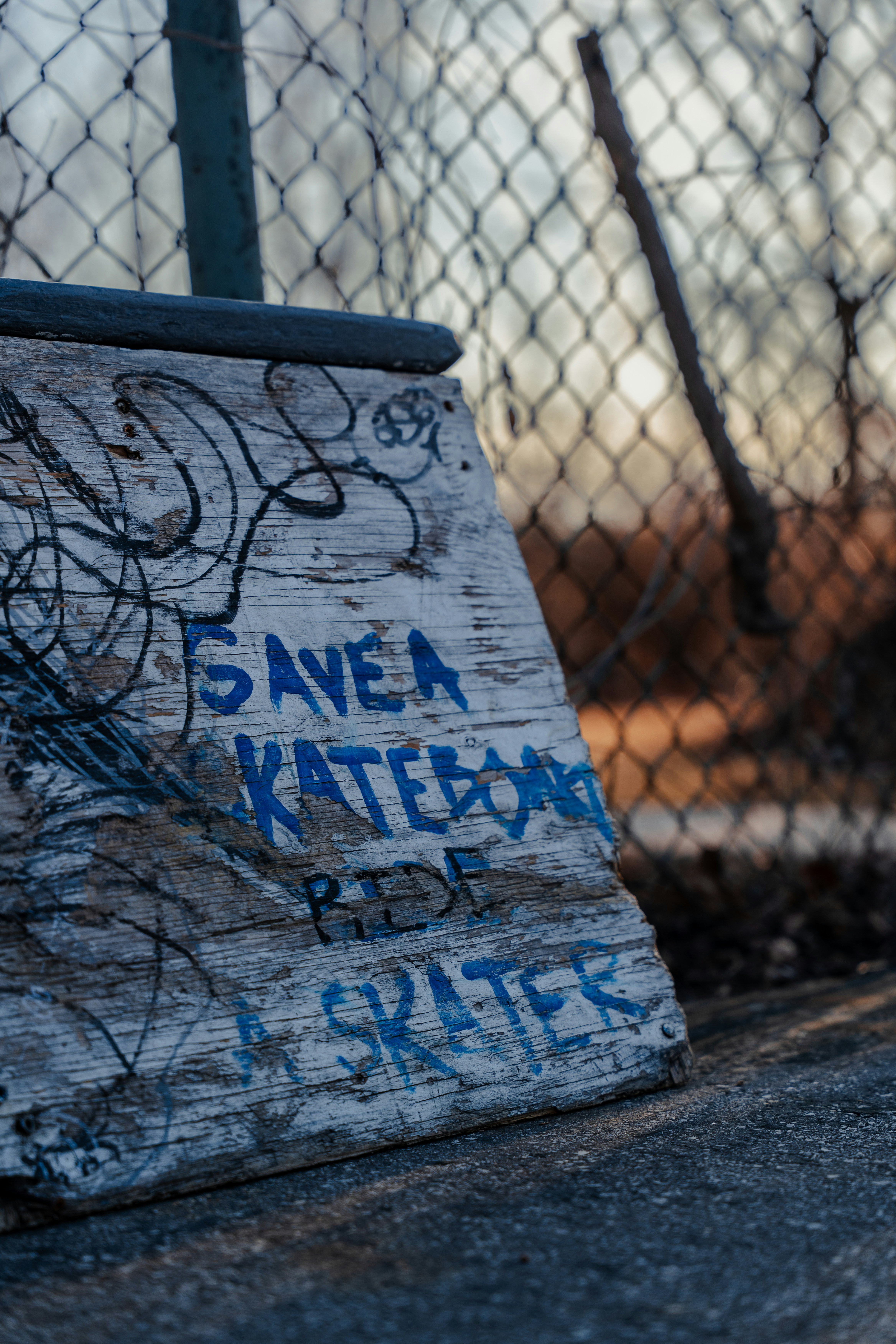 The image shows a sign with graffiti.
