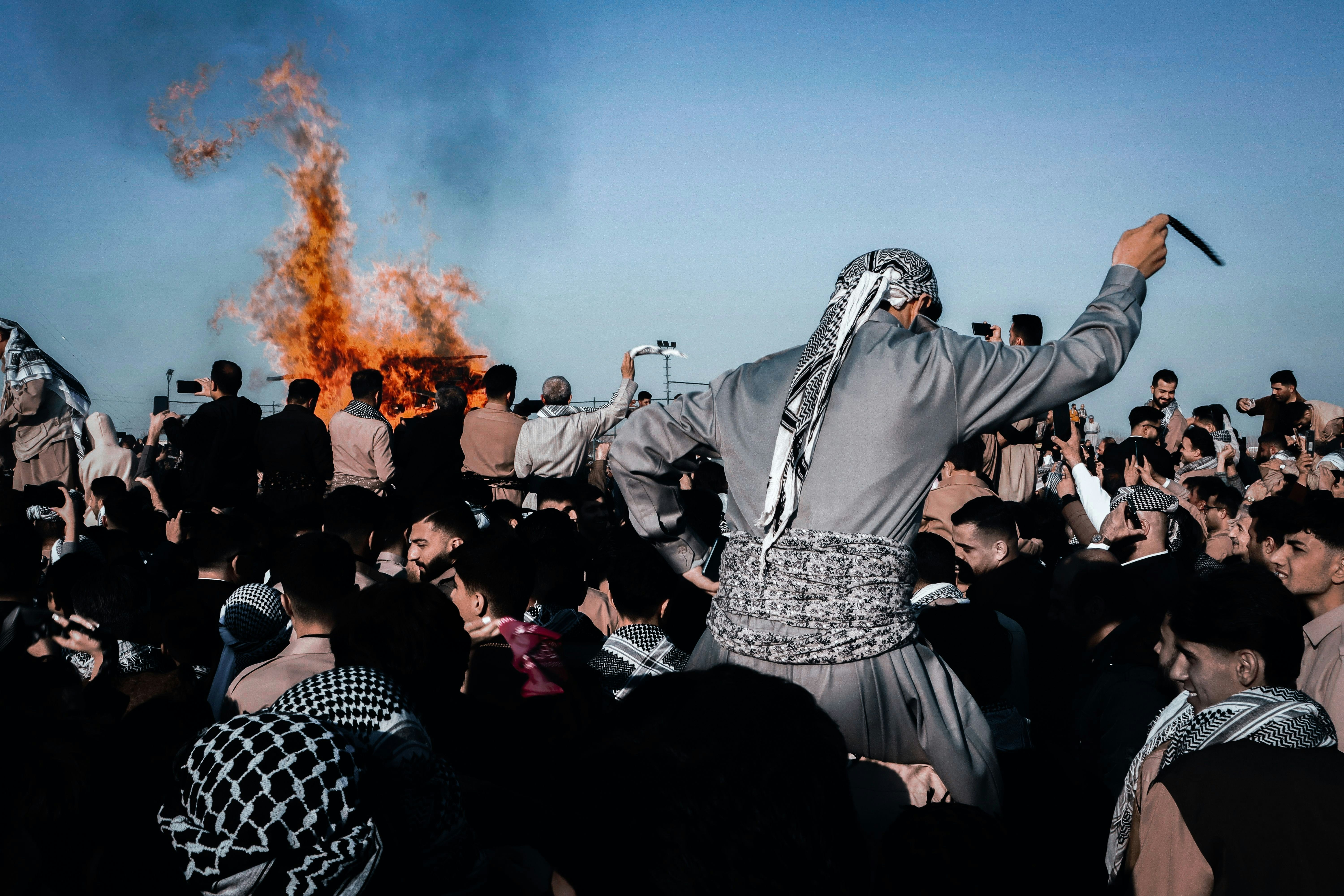 People celebrating amongst fire and celebration.