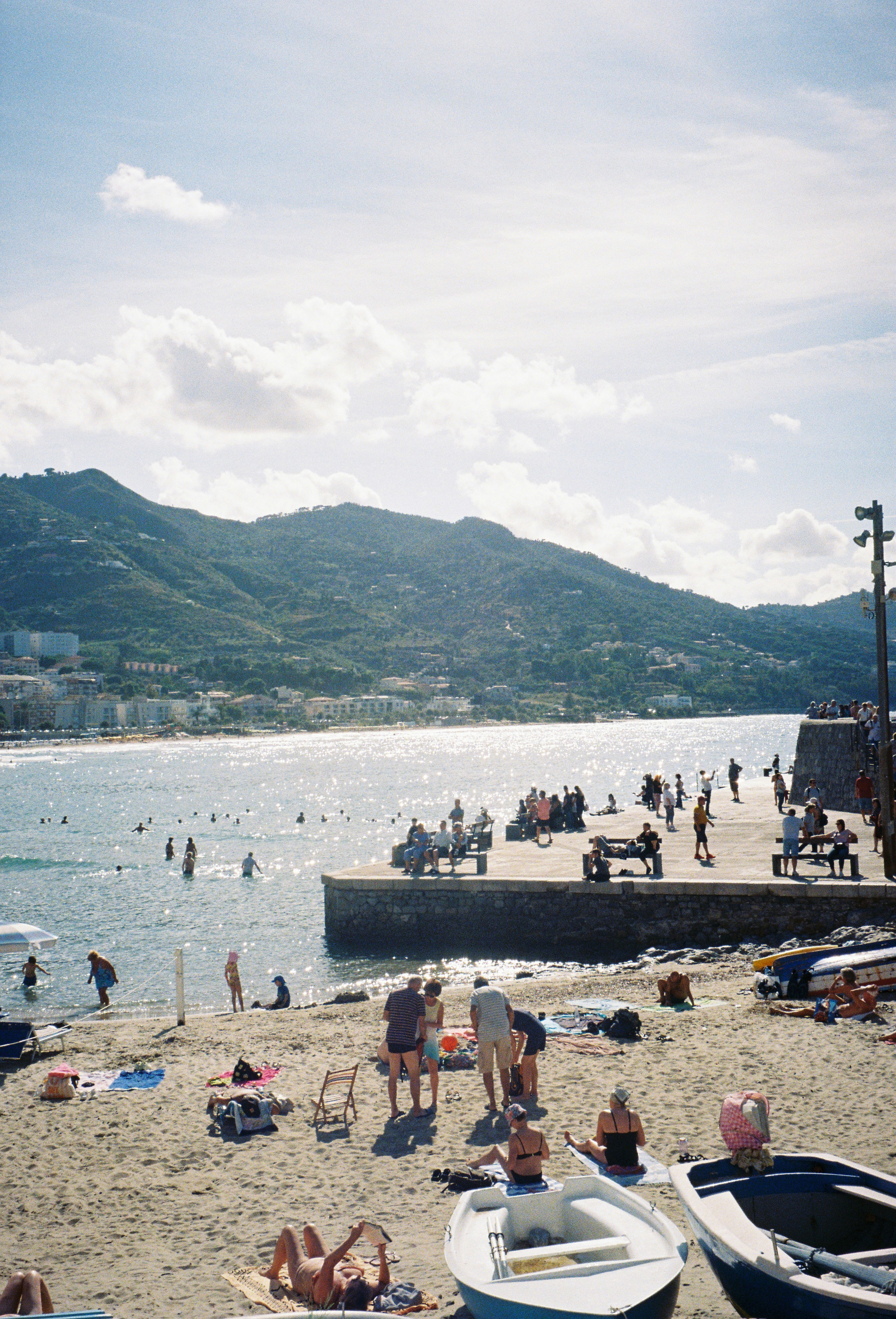 People enjoy a sunny day at the beach.