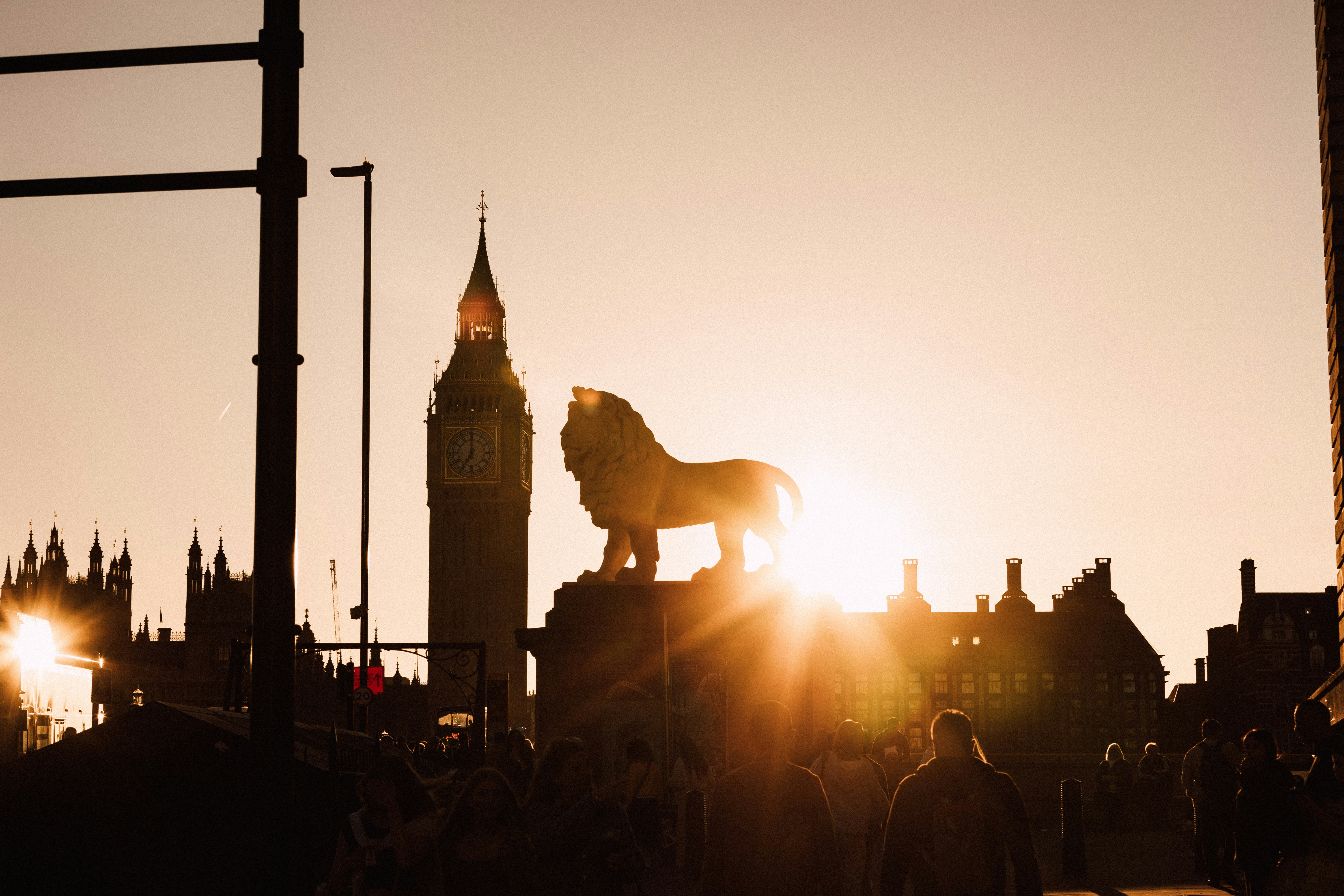 Golden sunset illuminates iconic london landmarks.