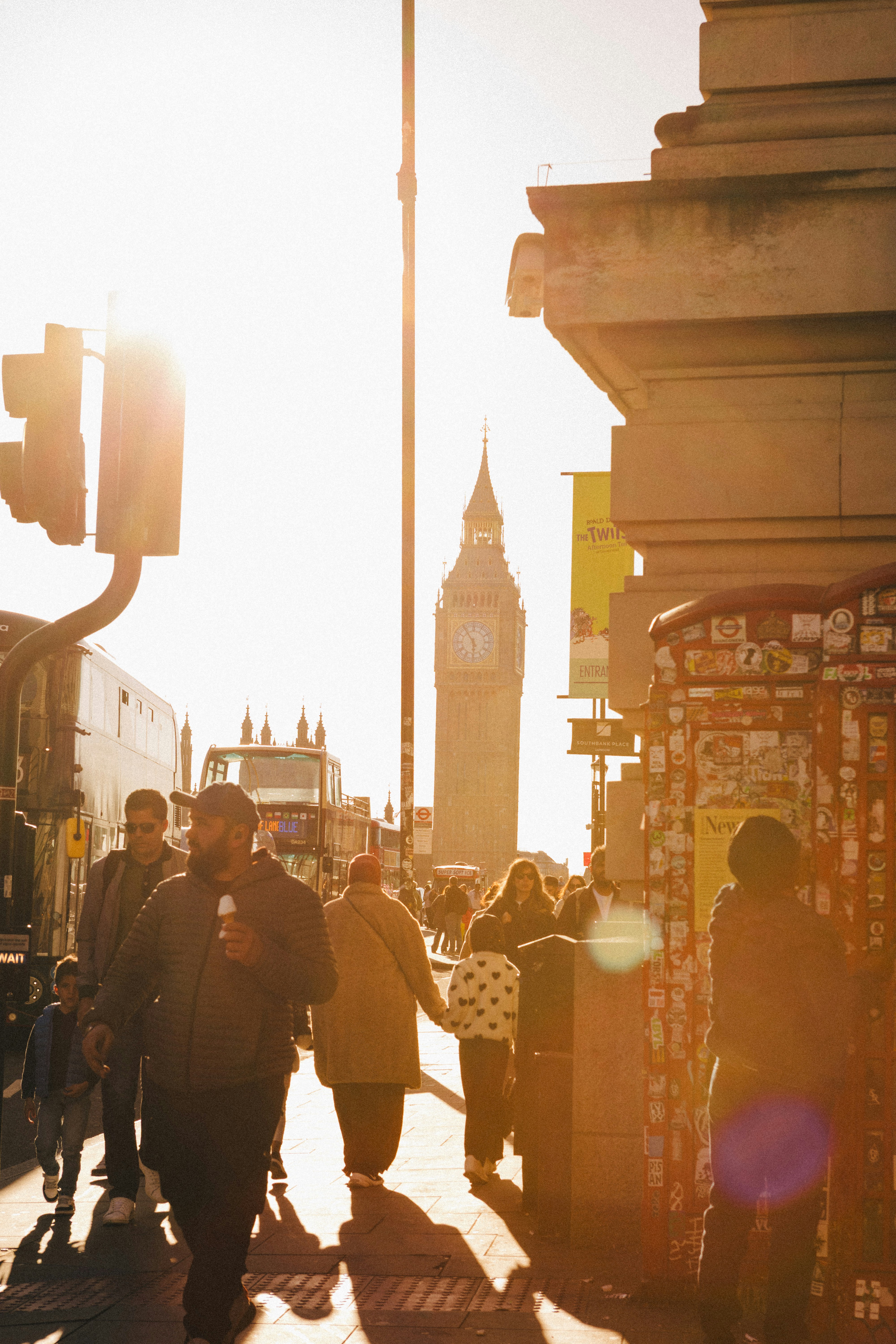 People walk toward big ben in london.