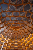 Honeycomb-like ceiling with an intricate design.