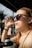 Woman shielding her eyes from the sun's glare.