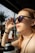 Woman shielding her eyes from the sun's glare.