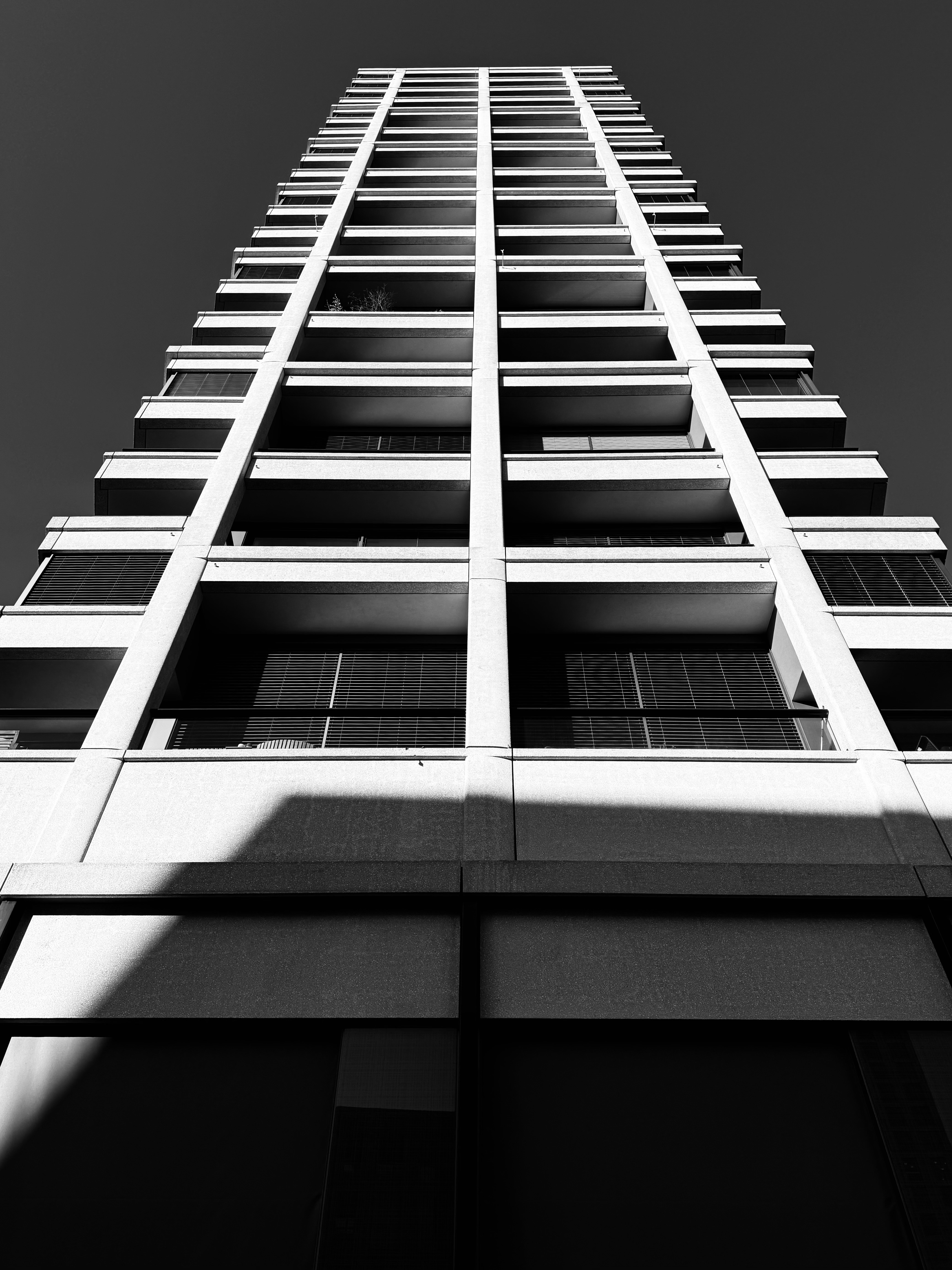 A tall building reaches towards the sky.