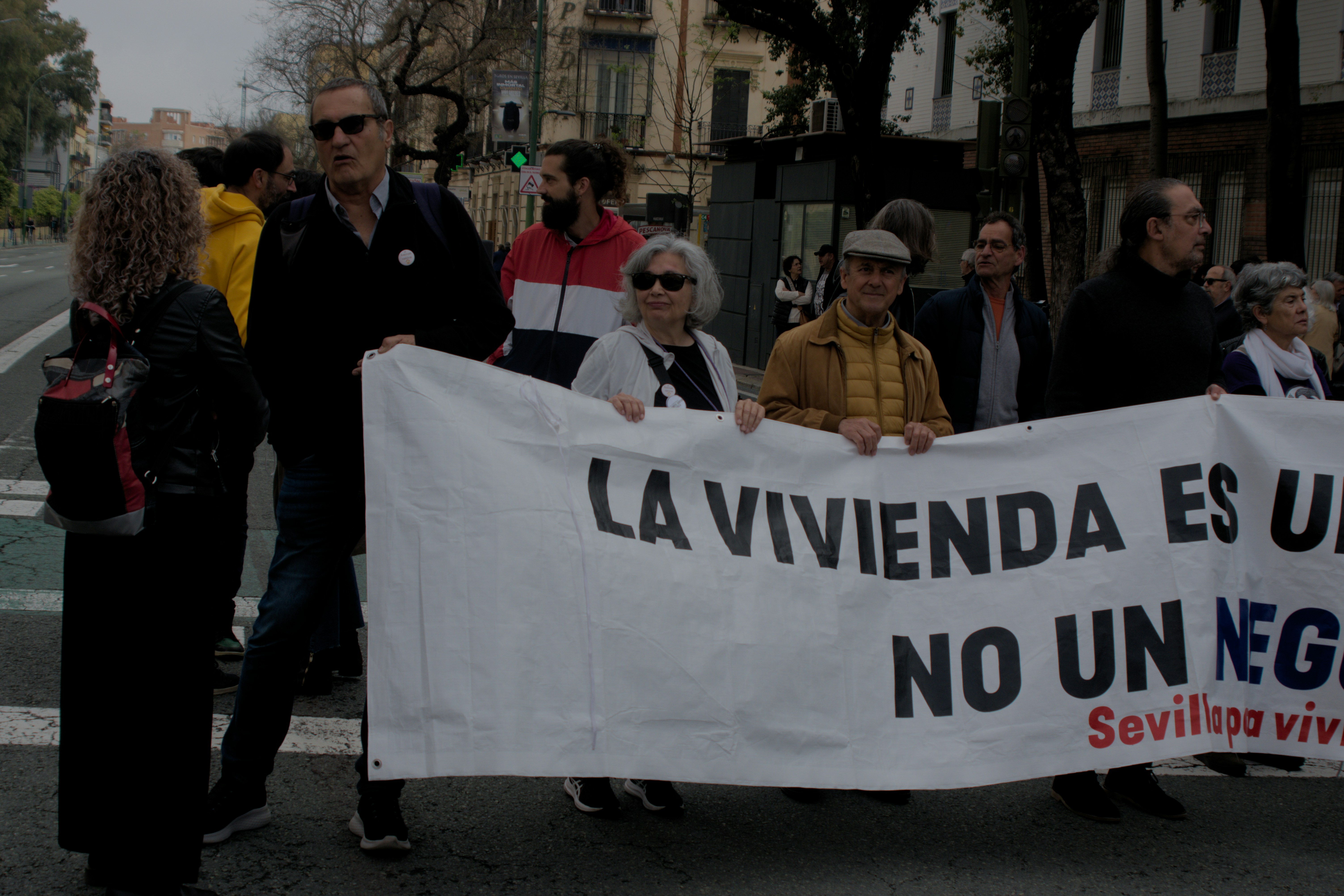 People are protesting with a banner.