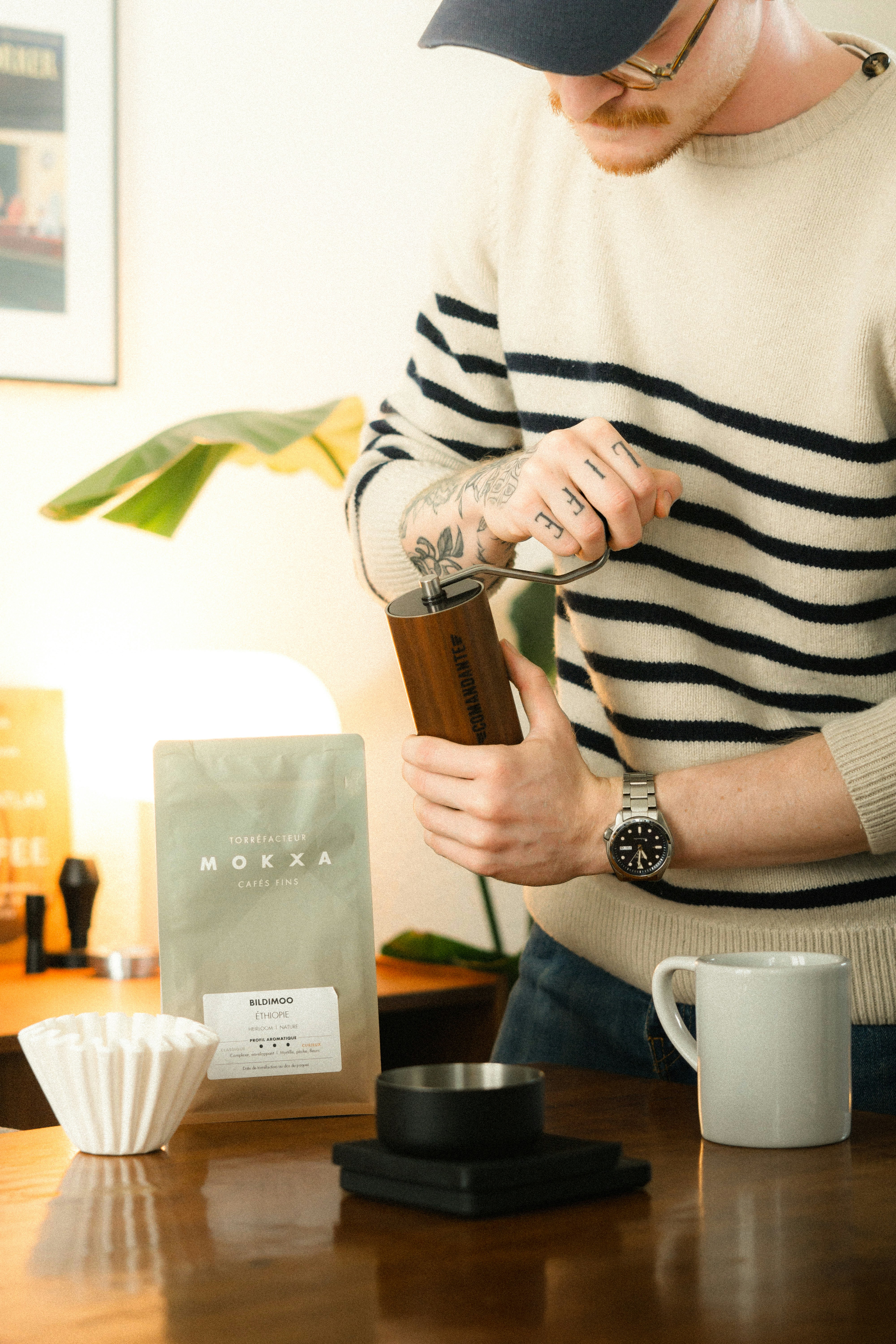 Man grinding coffee beans for a fresh brew.