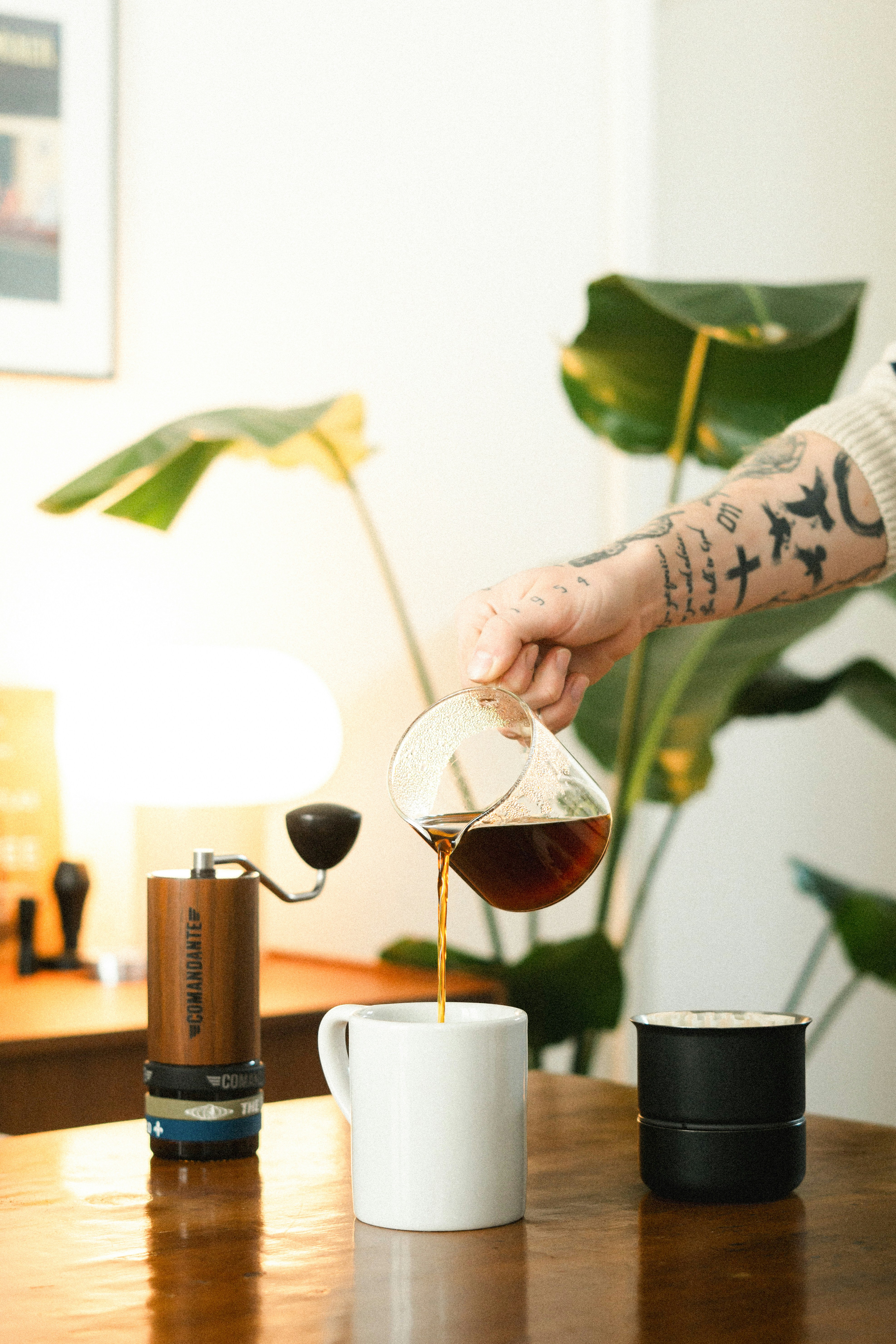 Coffee is being poured into a mug.
