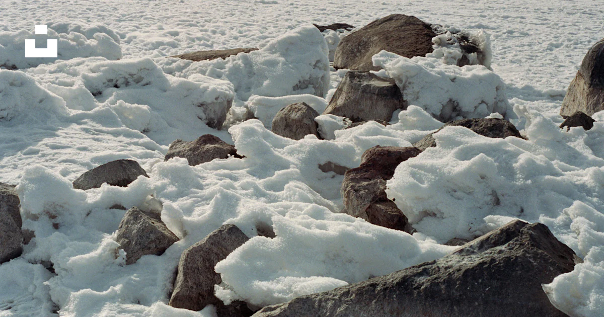 Falling Rocks Snow Rocks are covered in a thick layer of snow. photo – Free Winter Image ...