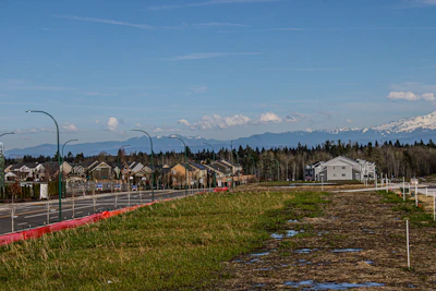 A suburban neighborhood is nestled near mountains