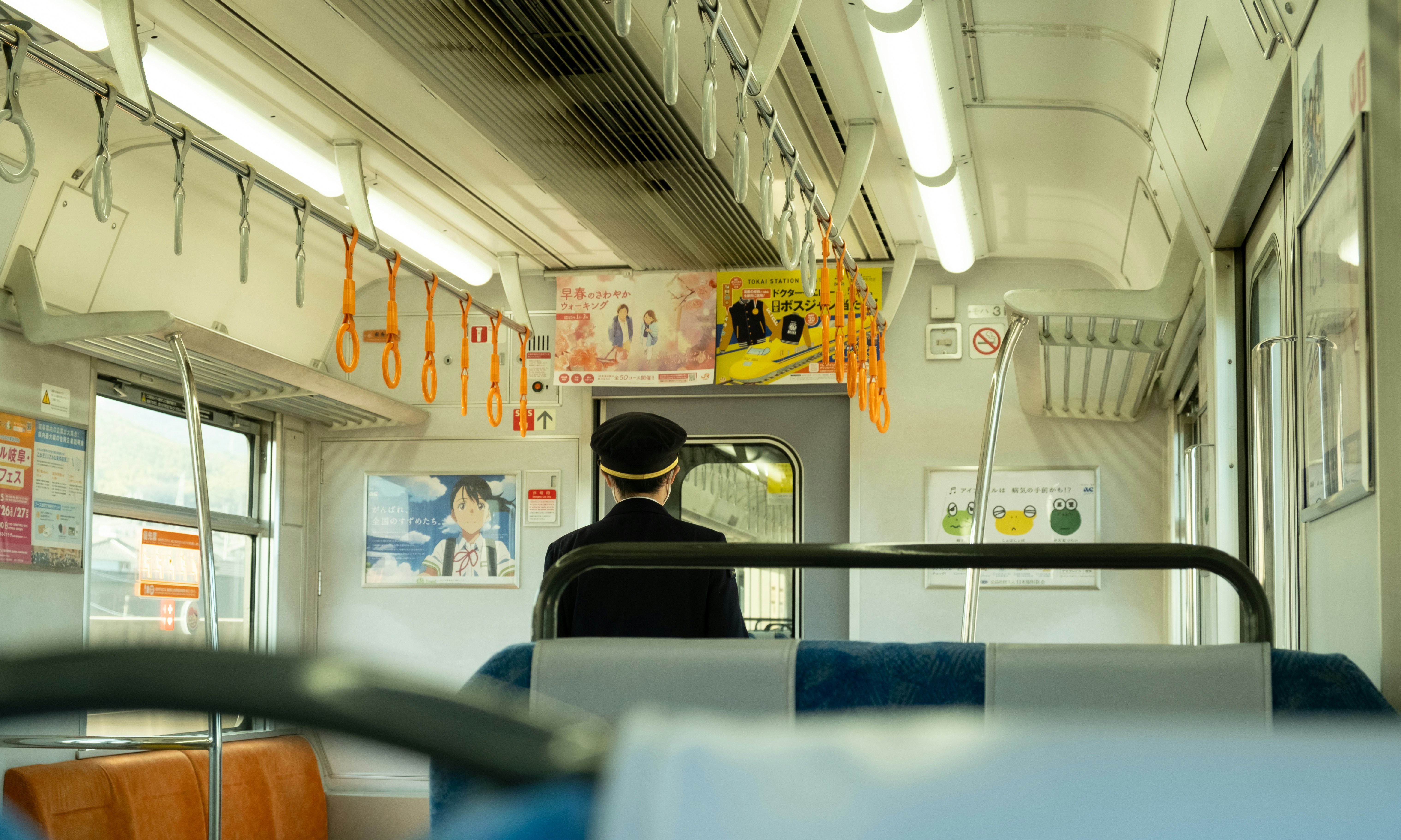 Inside a Japanese Shinkansen train, clean and modern interior