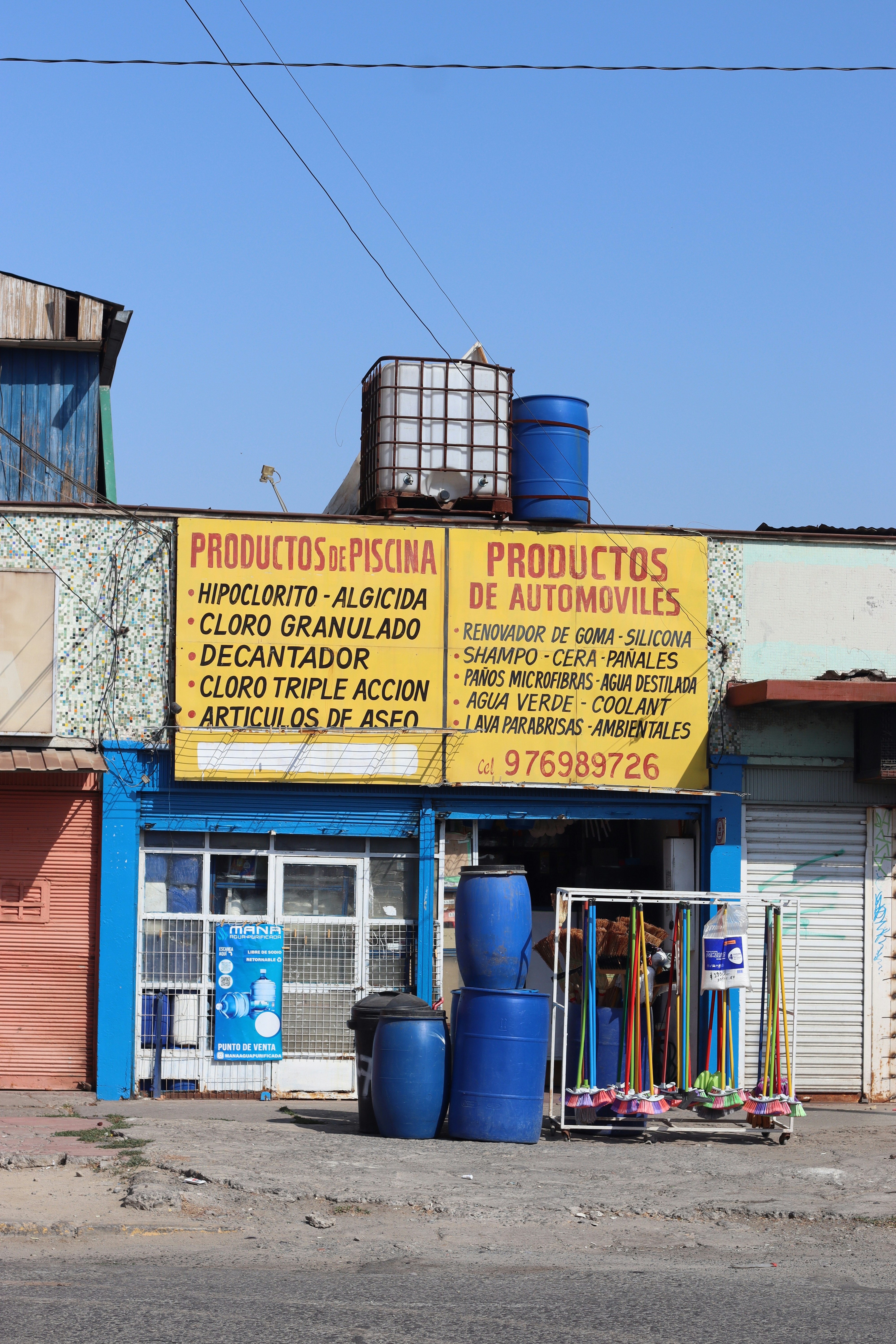 A small storefront sells pool and car products.