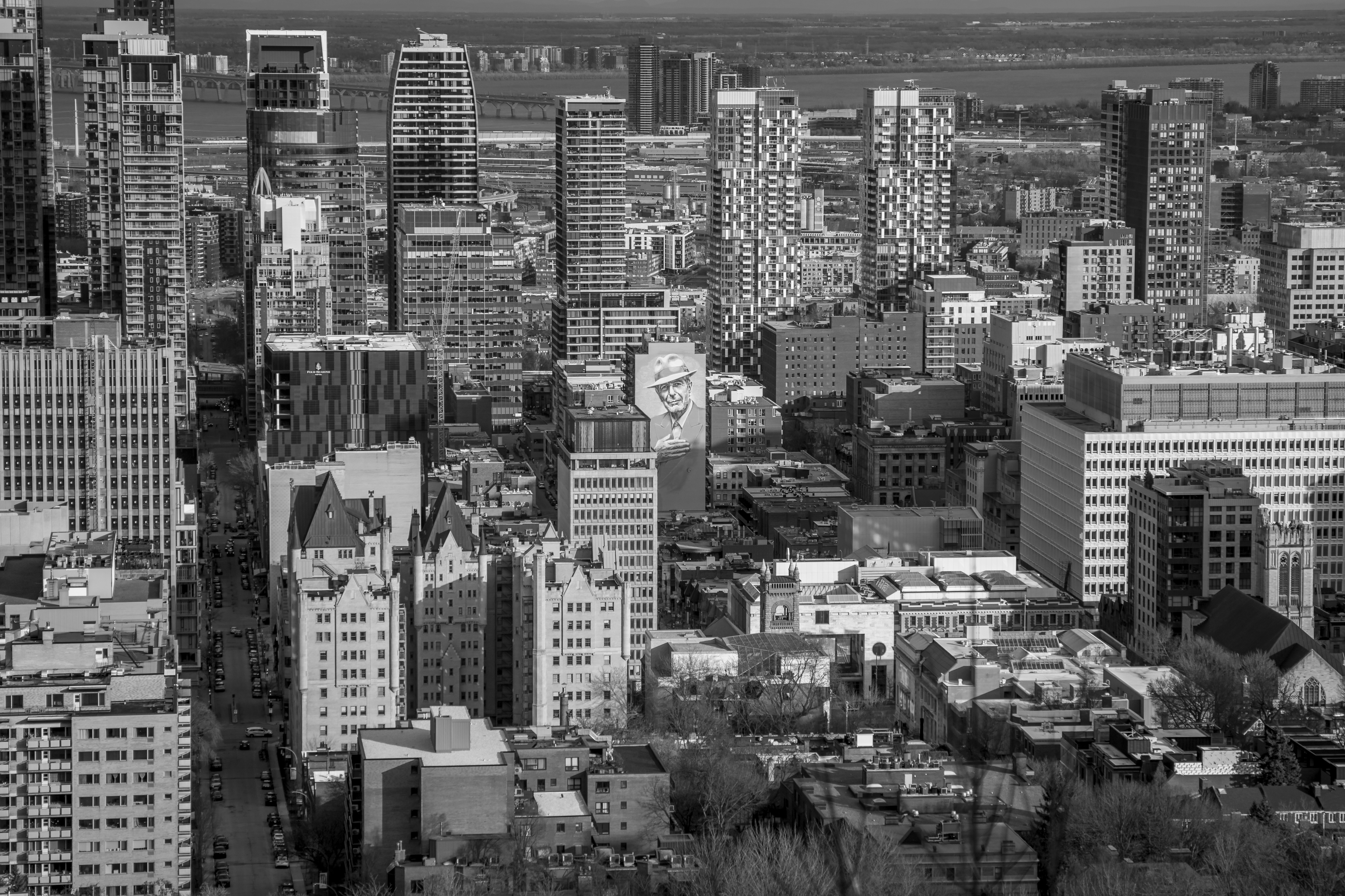 A black and white cityscape filled with buildings.