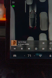 Tesla's display shows car's surroundings and music.