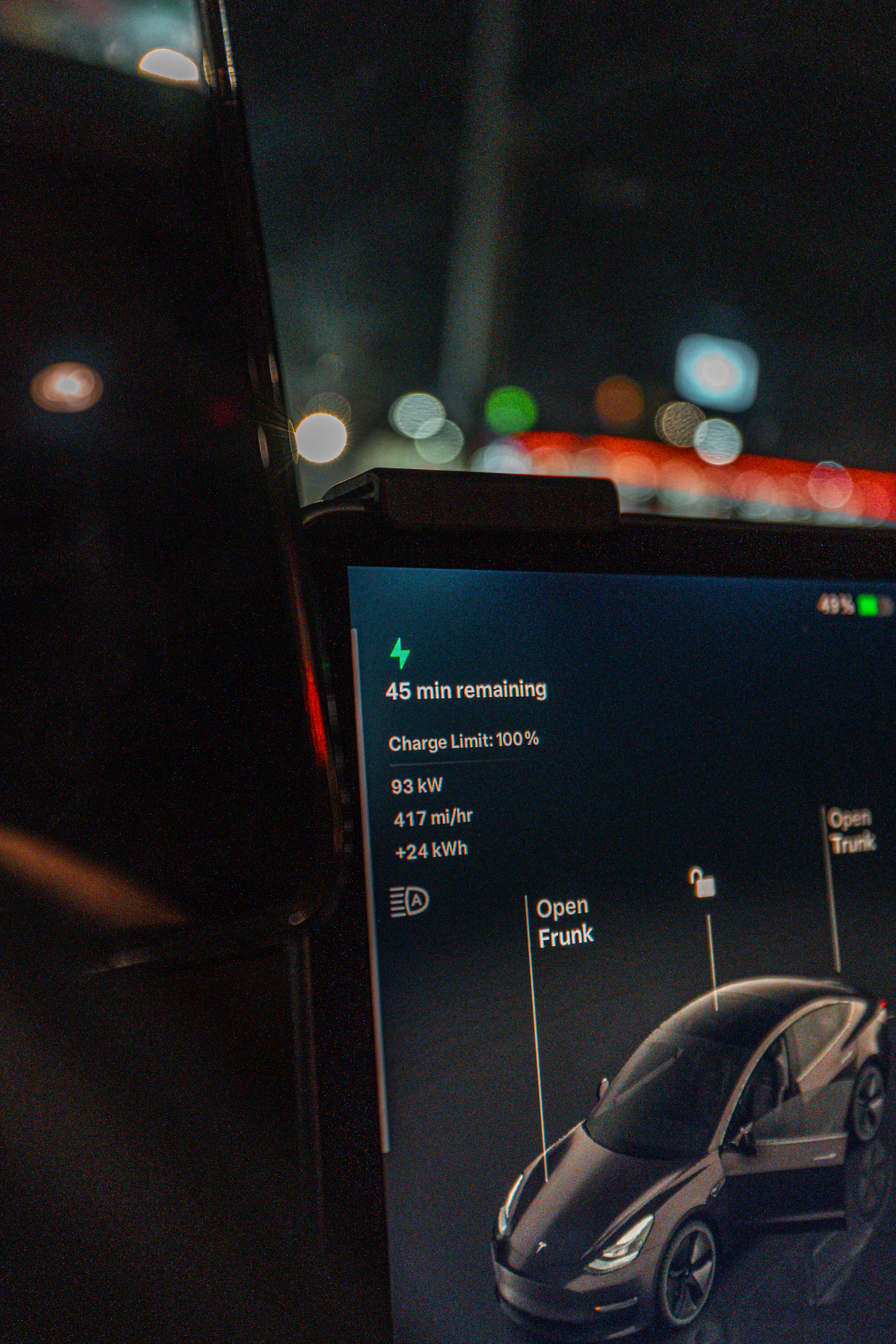 Tesla charging and showing remaining time and stats