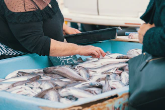 Fish are being sold at a market stall