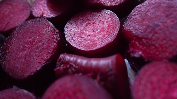 Freshly cut beets displayed in macro close-up.