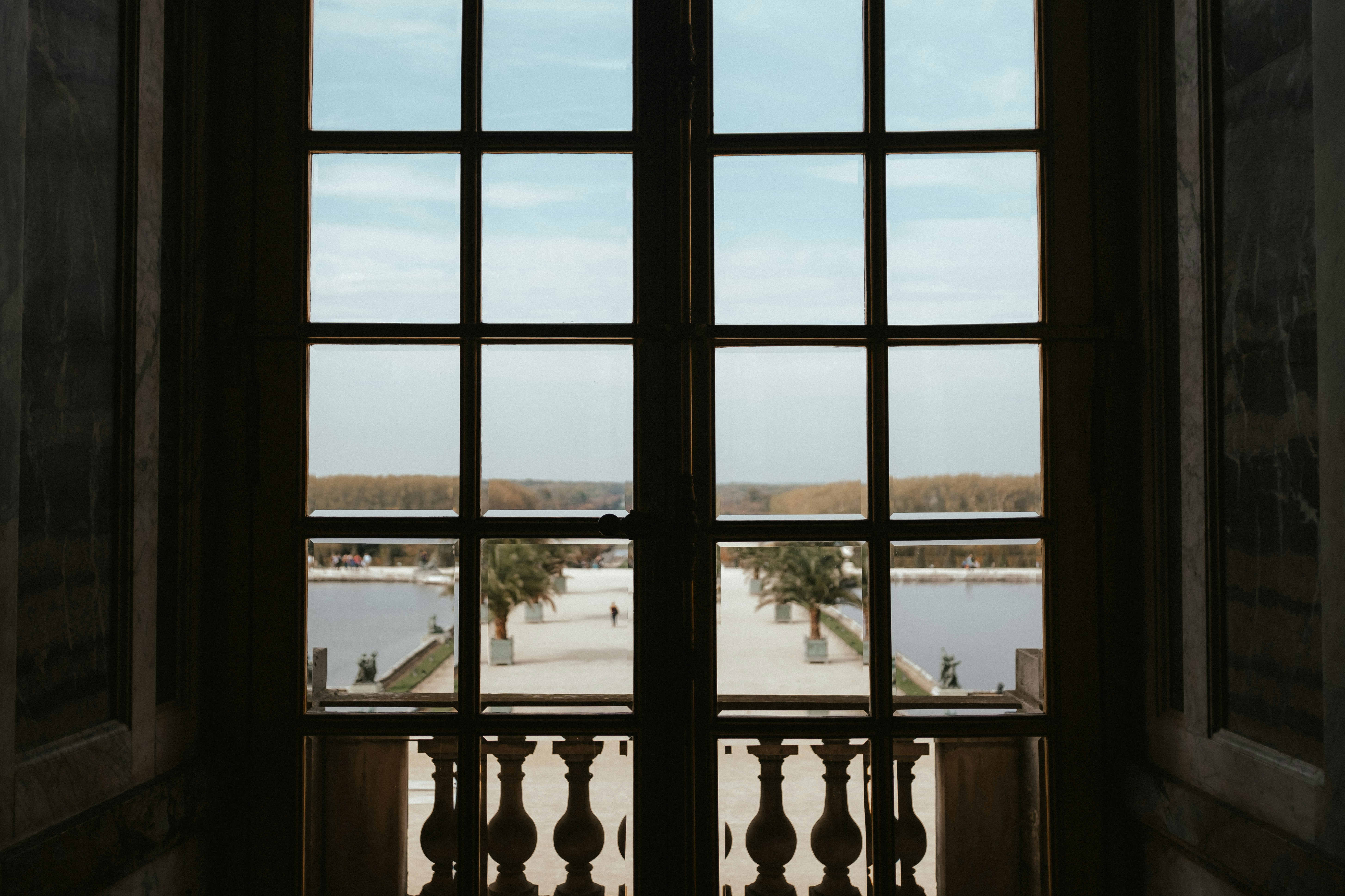 Image of a clear, beautiful impact window with a view - hurricane shutters boca raton fl