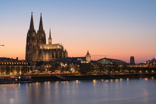 Cologne cathedral at dusk, reflected in the water