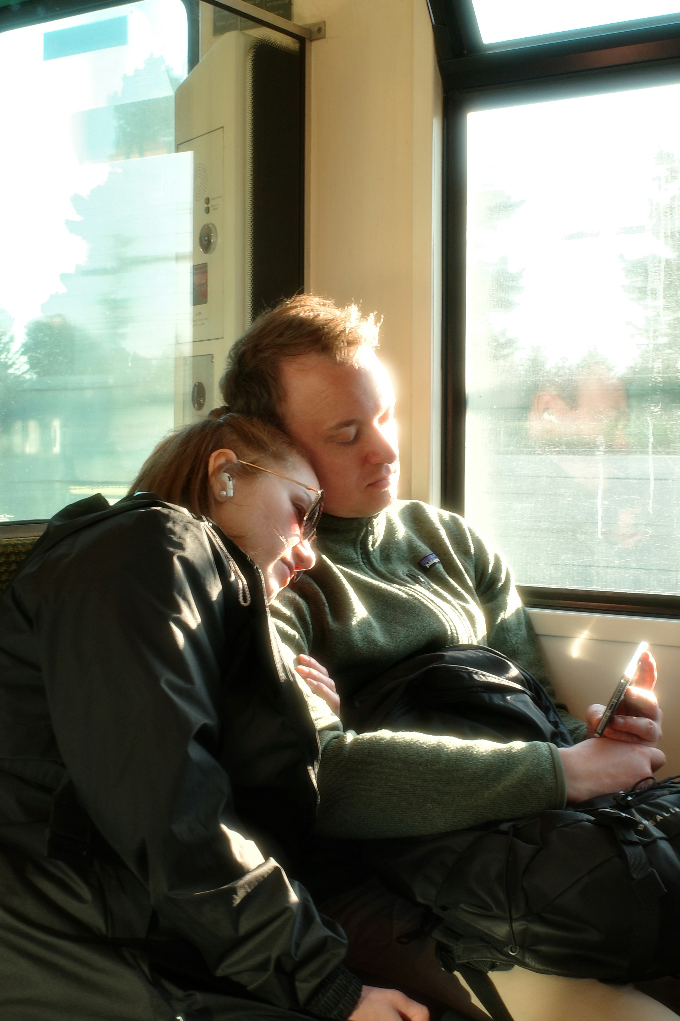 Tired parents looking at their baby