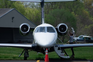 A private jet is parked on the tarmac.