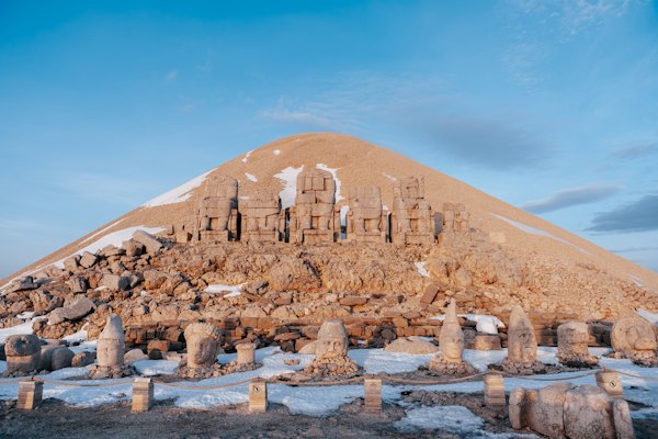 Ancient statues and a mausoleum on a mountain
