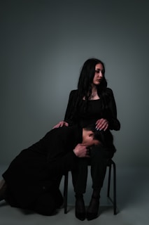 A woman comforts another woman.