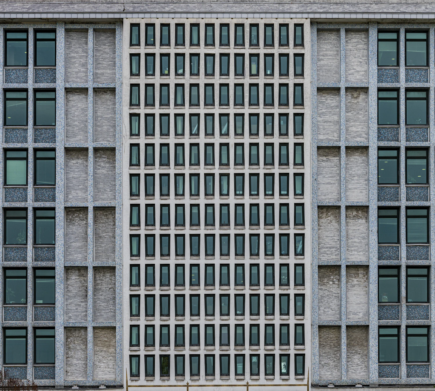 Keeping the camera level holds the verticals parallel, so the facade stands upright rather than tipping backwards.