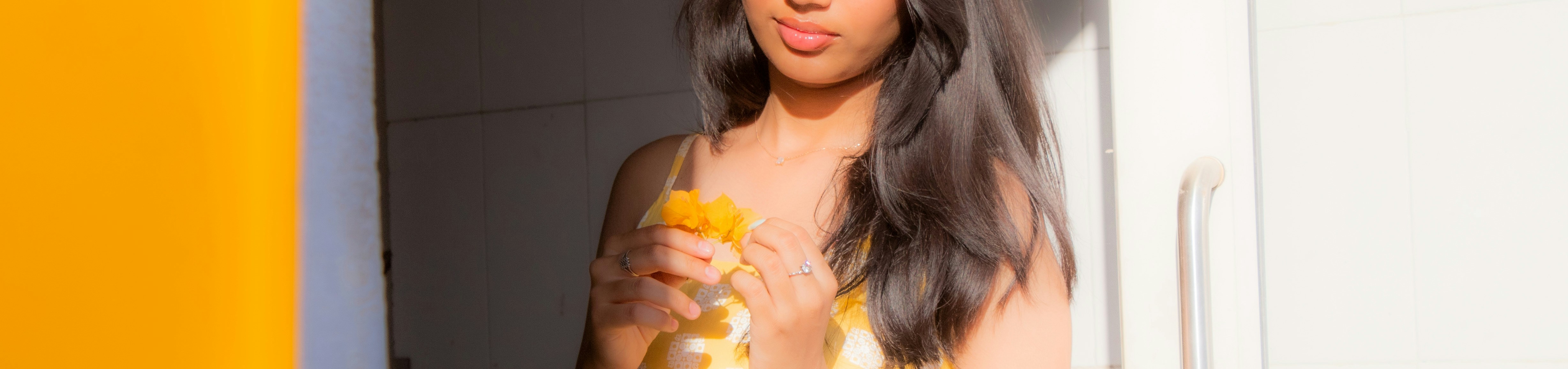 A woman is holding something with her hands
