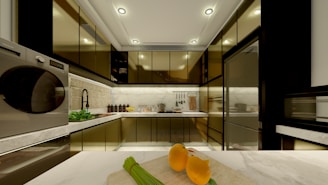 A modern kitchen with appliances and fruit.