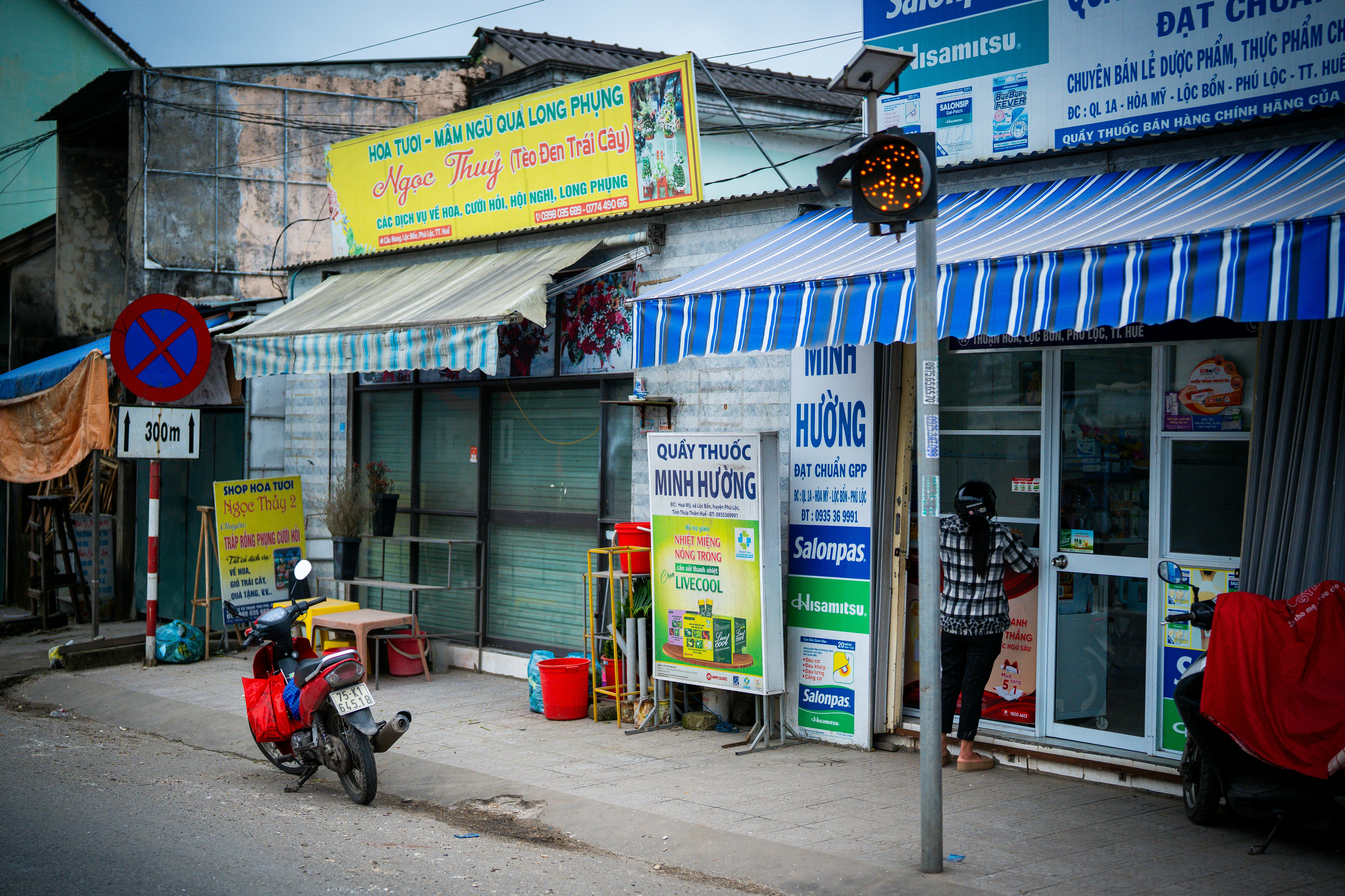 A street in a busy vietnamese town.