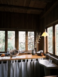 A rustic kitchen with a window view.