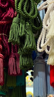 Colorful tassels are displayed, ready for sale.