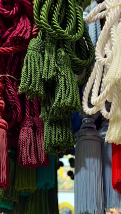Colorful tassels are displayed, ready for sale.