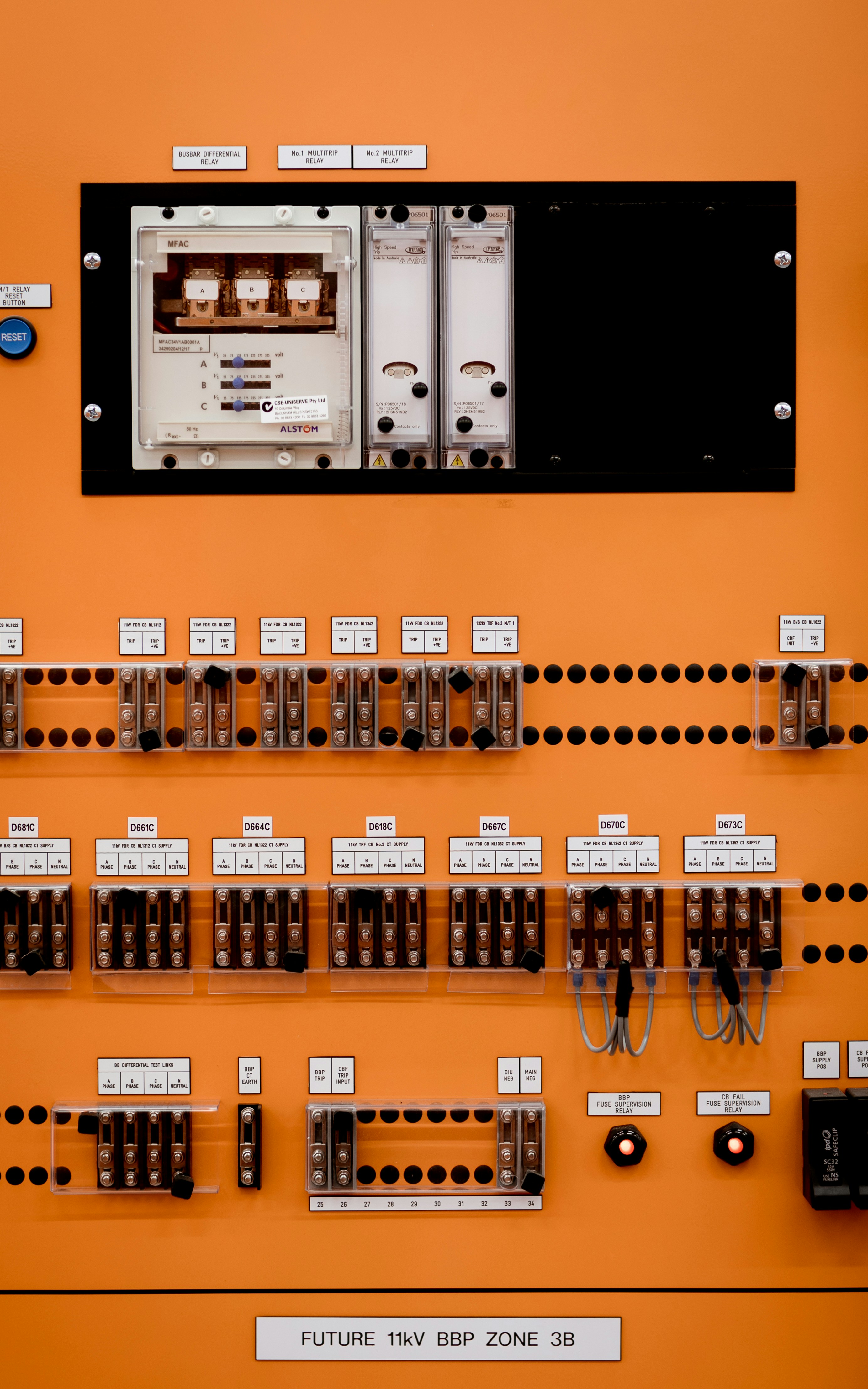 Control panel with electrical components is shown.