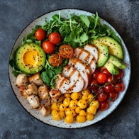 Chicken salad with avocado and tomatoes.
