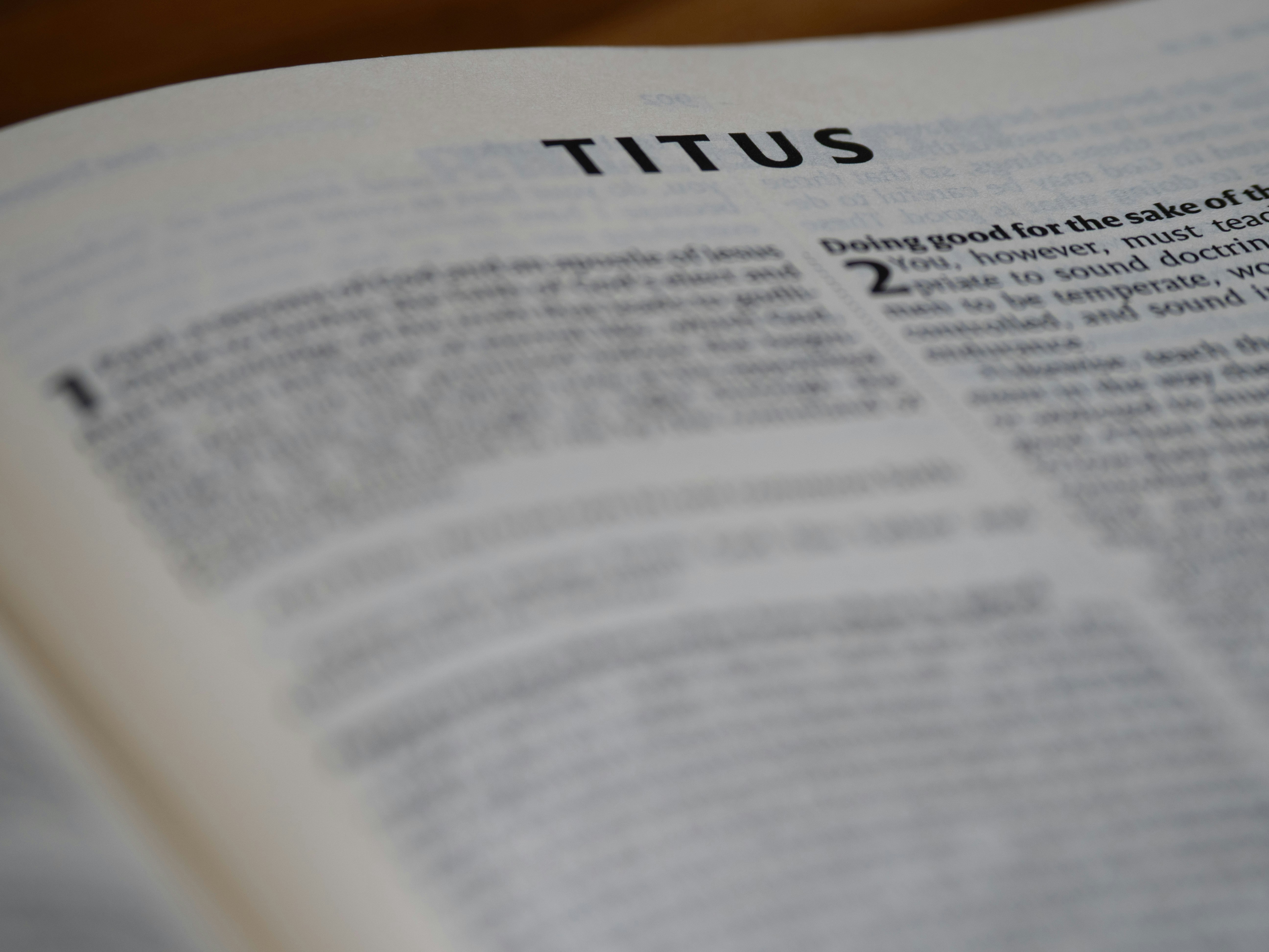 The book of titus is open and visible.