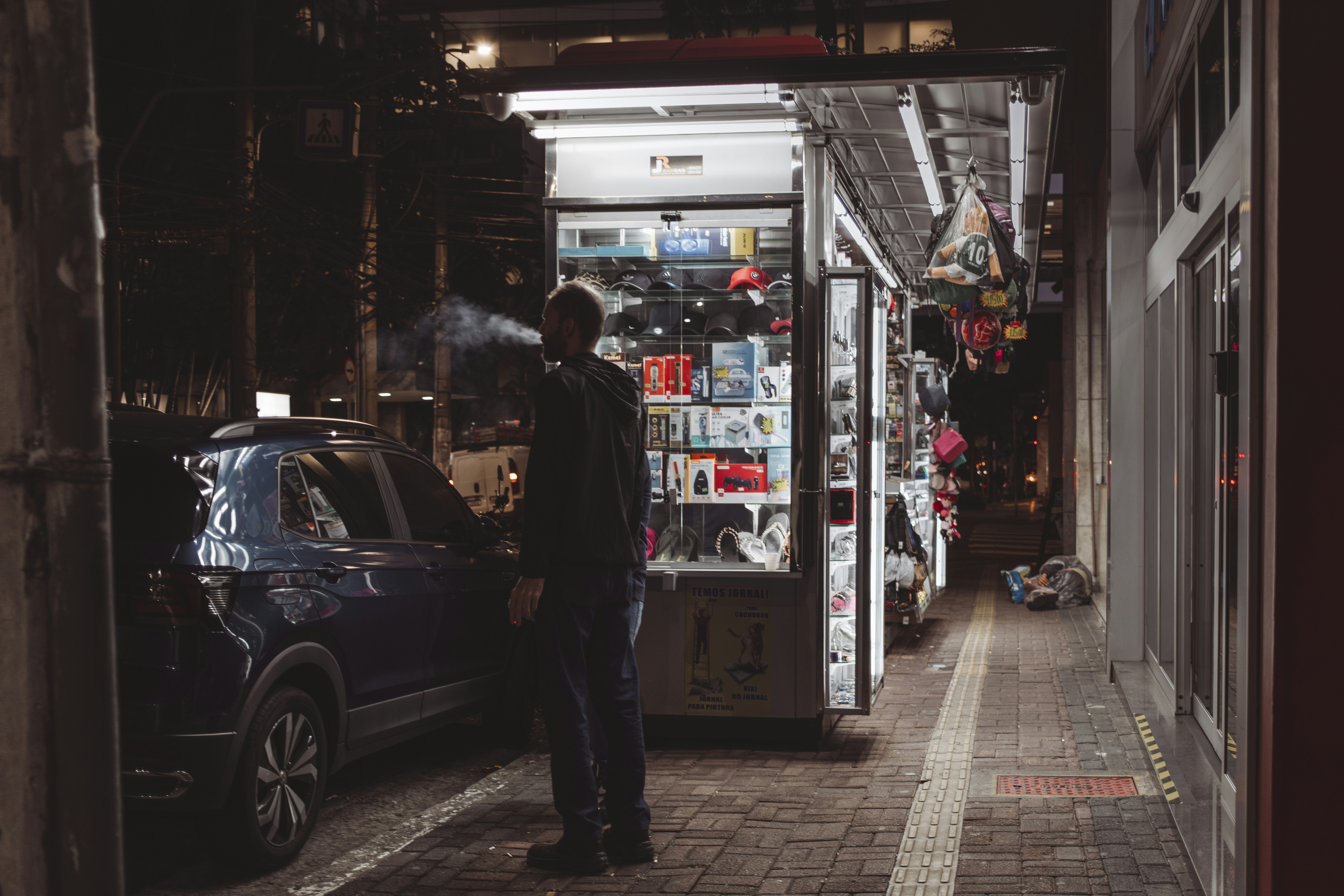 Family evaluating an electric car with a salesperson at a dealership